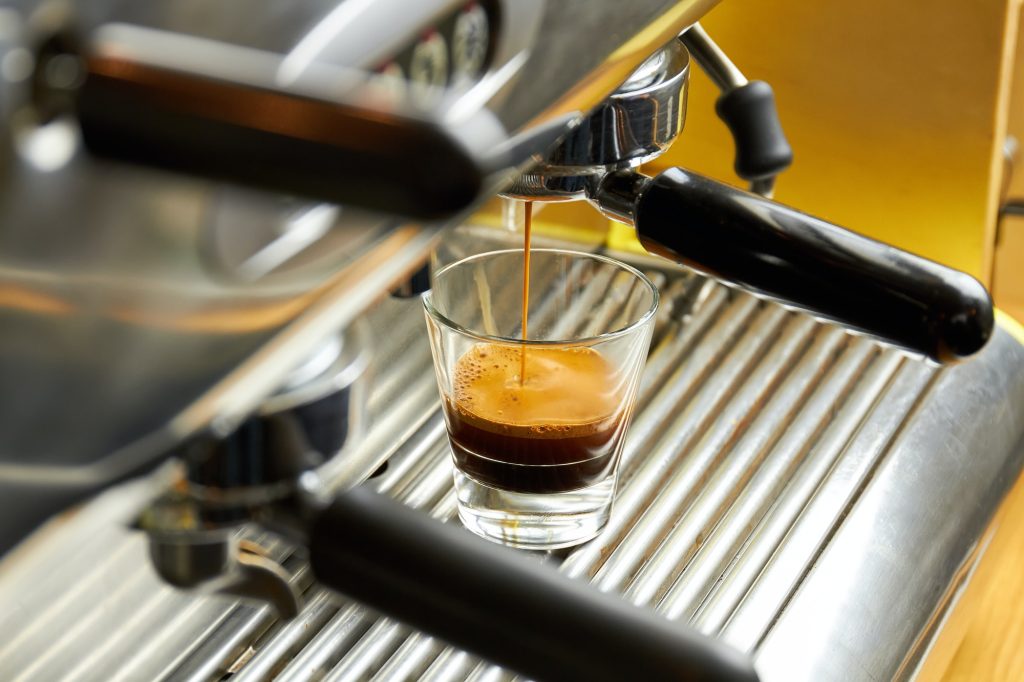 Coffee machine pouring espresso